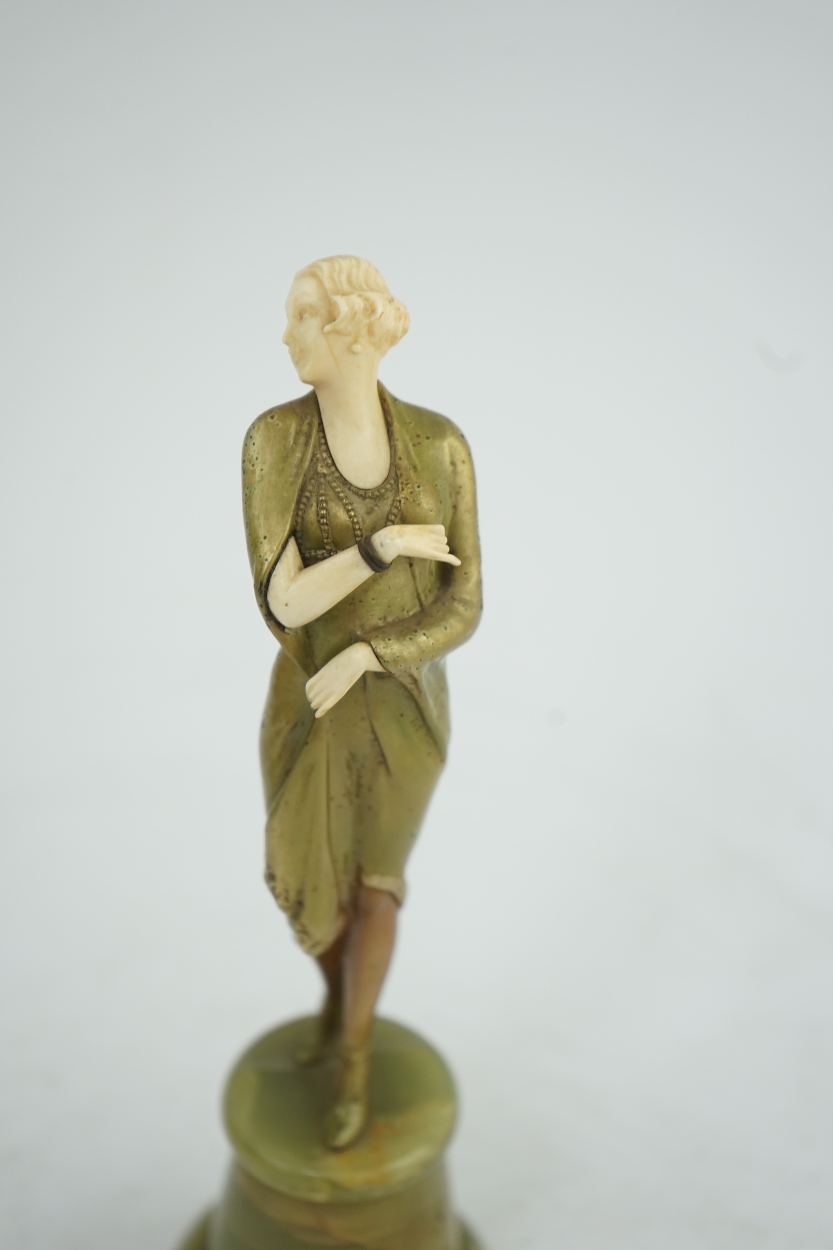 Attributed to Josef Lorenzl. An Art Deco bronze and ivory figure of a stylish lady